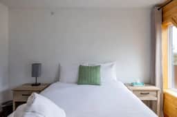 Suite 5 at The Gem | Bright 2BR Stay for Groups - Image 2